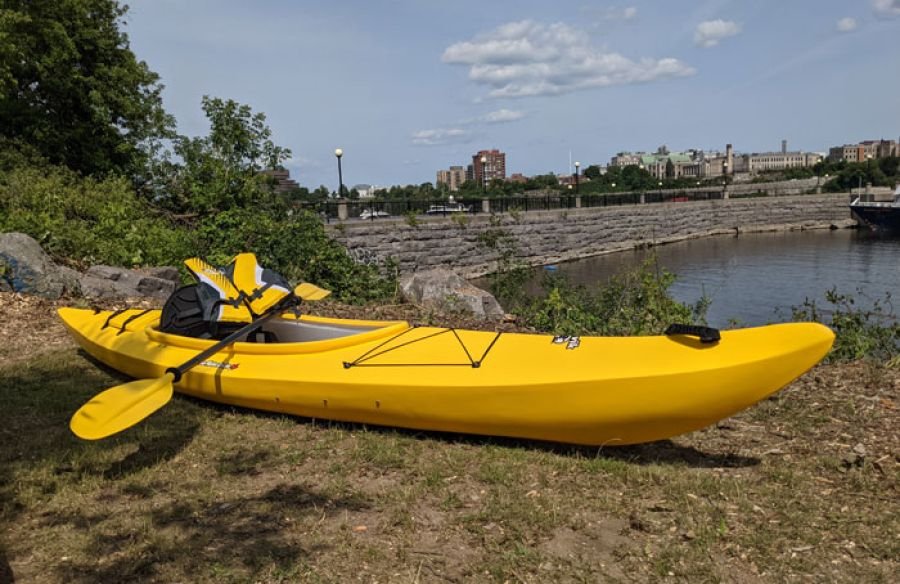 Rental kayak, paddle, and life jacket beside the Ottawa River