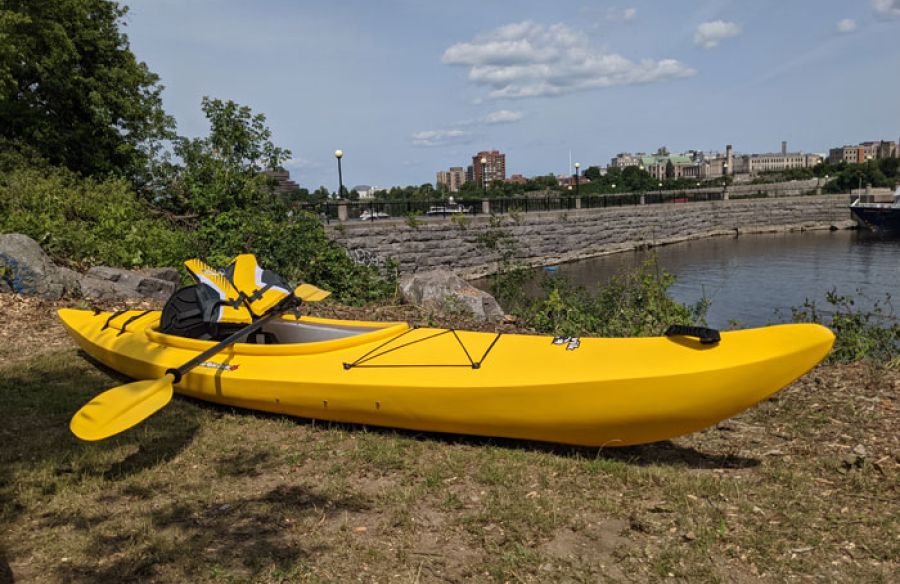 Rental kayak, paddle, and life jacket beside the Ottawa River